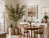 Sunlit small dining room with a wooden table and leafy branches